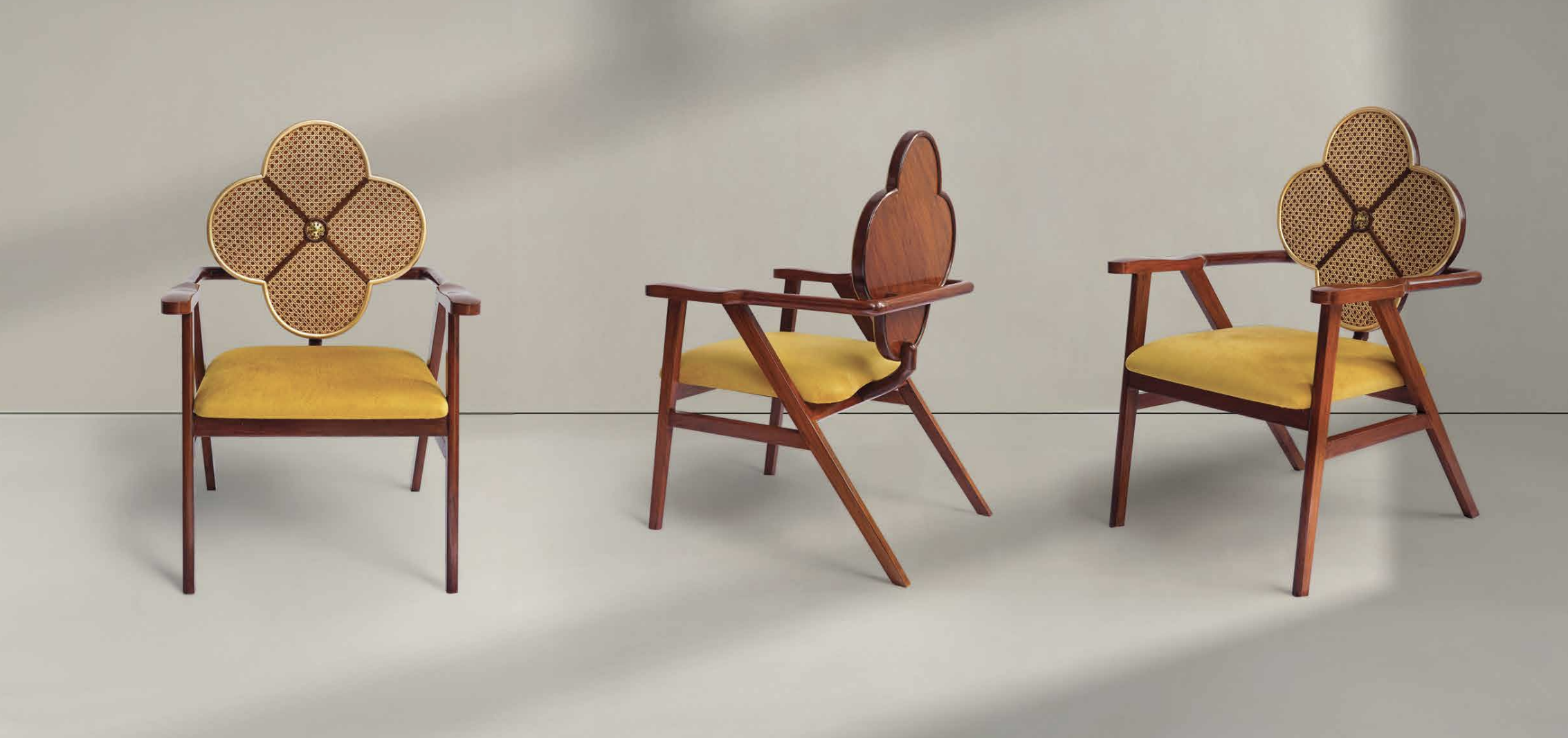 Cane Backrest Wooden Chair with Yellow Seat Cushion – A wooden armchair with a flower-shaped cane backrest, framed in gold. The warm yellow upholstered seat contrasts with the rich brown wood, giving it a vintage-inspired yet contemporary look.
